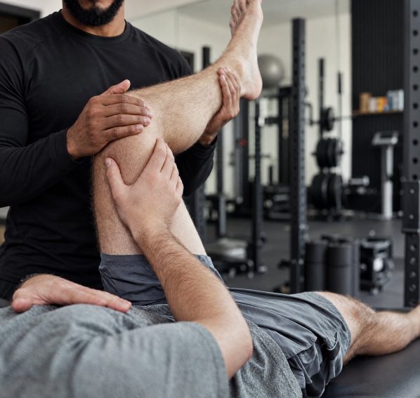 Duane giving a hamstring stretch in the Crouch End studio